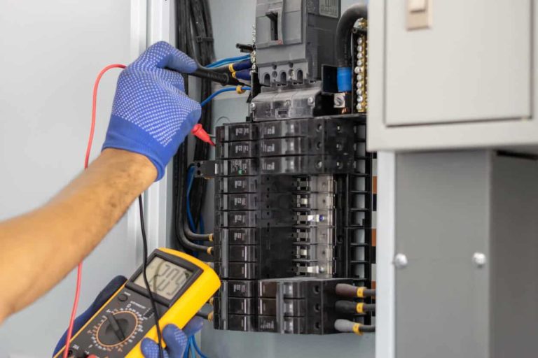 electrician-inspecting-circuit-breaker-panel
